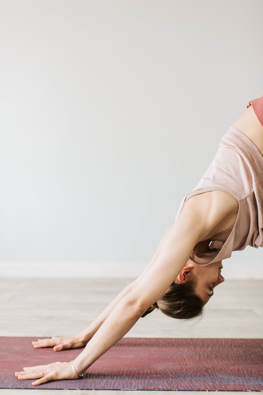 Athlete stretching in a deep yoga pose.